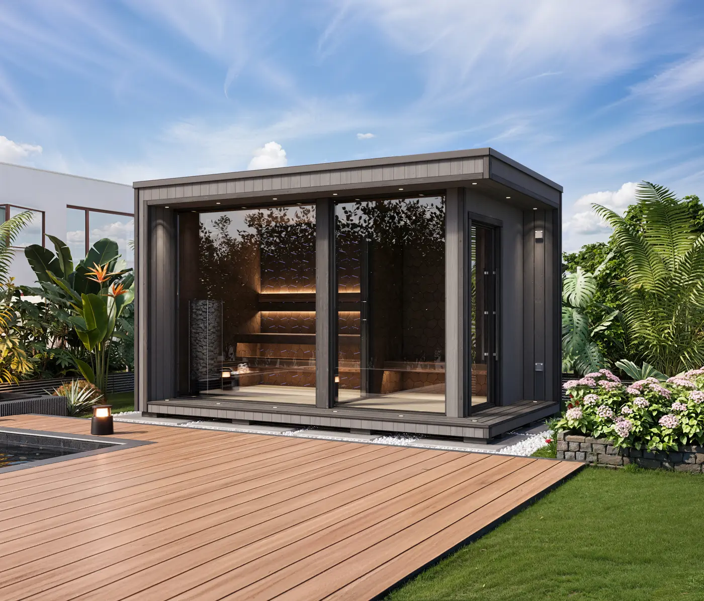 A charcoal sauna on a timber deck surrounded by garden greenery